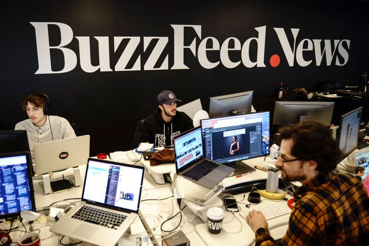 Members of the BuzzFeed News team work at their desks at BuzzFeed headquarters in New York. Employees at the internet media and news company have been demanding that management recognize their union.