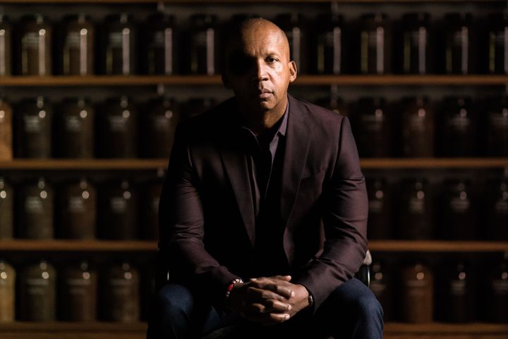 Bryan Stevenson sits in front of a wall of jars filled with soil collected from lynching sites across the country. The jars are located inside the Equal Justice Initiative's museum opened last year in Alabama, alongside its National Memorial for Peace and Justice, dedicated to the thousands of lynching victims in the U.S.