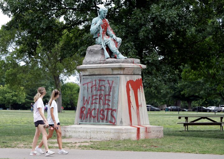 People walk past a monument to Confederate soldiers in Centennial Park in Nashville, Tennessee, on Monday.