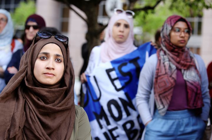 Women protest Quebec's new Bill 21, which will ban teachers, police, government lawyers and others in positions of authority from wearing religious symbols such as Muslim head coverings and Sikh turbans, in Montreal on June 17.