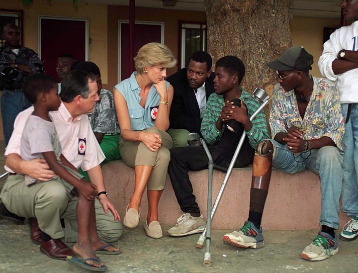 Princess Diana sits with victims of land mines at Neves Bendinha, an orthopedic workshop In Luanda, Angola in 1997.