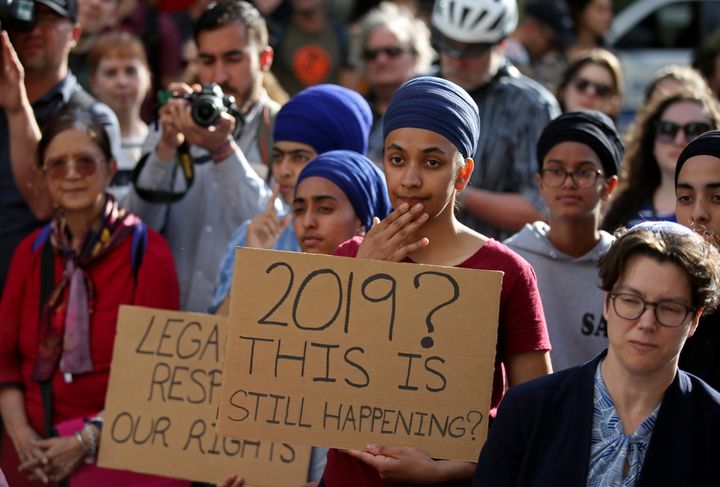 People protest Quebec's new Bill 21, which will ban teachers, police, government lawyers and others in positions of authority from wearing religious symbols such as Muslim head coverings and Sikh turbans, in Montreal on June 17.