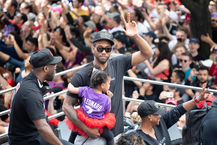 Kawhi Leonard and his daughter in Toronto On June 17, 2019.