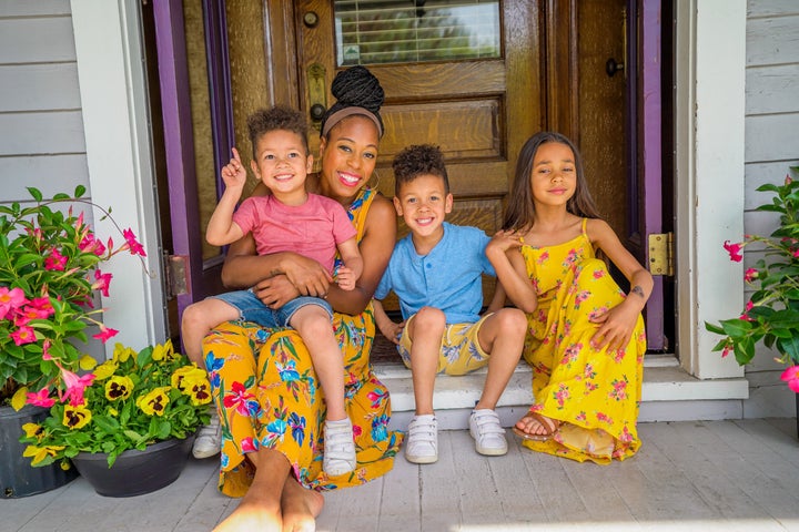 Britt Null, pictured here with her three children, runs a family-friendly vlog on YouTube. 