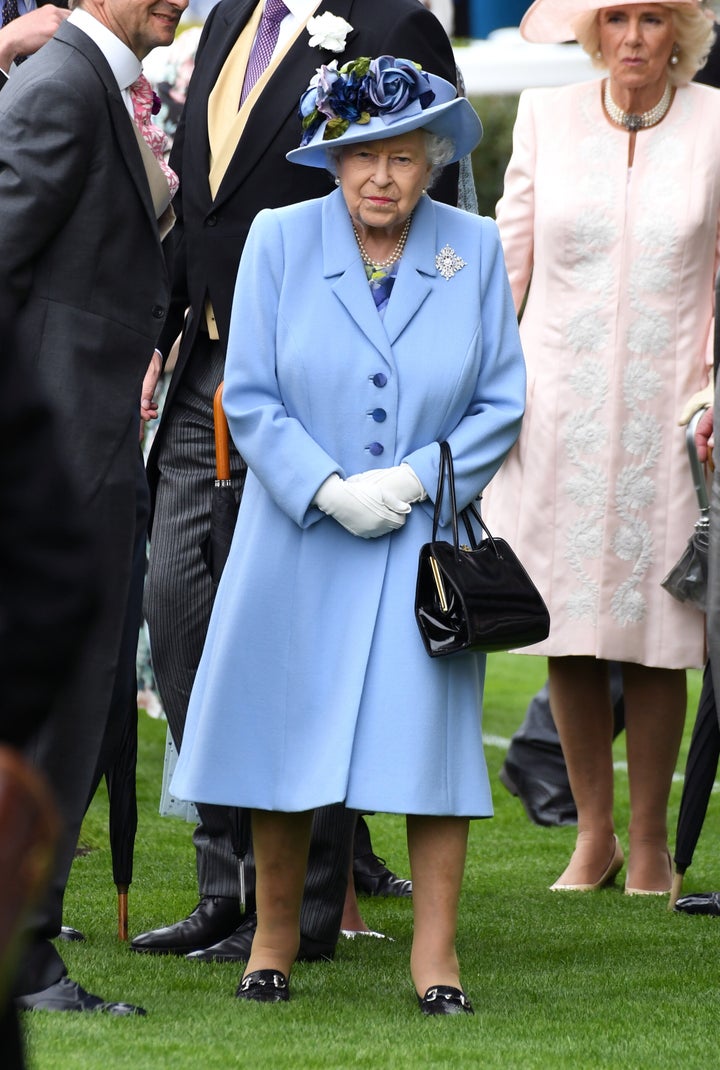 Queen Elizabeth II, with Camilla, Duchess of Cornwall, right behind her. 