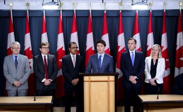 Prime Minister Justin Trudeau announces the government's decision on the Trans Mountain Expansion Project with Environment Minister Catherine McKenna, Finance Minister Bill Morneau, Natural Resources Minister Amarjeet Sohi, Fisheries Minister Jonathan Wilkinson and Transport Minister Marc Garneau in Ottawa on June 18, 2019.