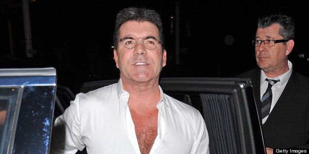 LONDON, UNITED KINGDOM - APRIL 11: Simon Cowell sighting arriving at the My Beautiful Ball fundraiser at the Landmark Hotel on April 11, 2013 in London, England. (Photo by Alan Chapman/FilmMagic)