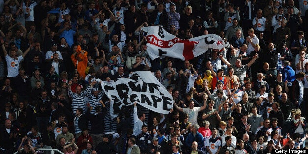 STOKE ON TRENT, ENGLAND - MAY 13: Bolton Wanderers fans celebrate during the Barclays Premier League match between Stoke City and Bolton Wanderers at Britannia Stadium on May 13, 2012 in Stoke on Trent, England. (Photo by Laurence Griffiths/Getty Images)