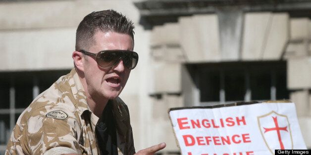 LONDON, ENGLAND - MAY 27: English Defence League (EDL) leader Tommy Robinson speaks to supporters during a rally outside Downing Street on May 27, 2013 in London, England. The EDL are protesting what the group sees as a lack of support and protection given to British troops following the terror attack last week, in which soldier Drummer Lee Rigby was murdered in a knife and machete attack by two Muslim men outside Woolwich Barracks. A counter demonstration is planned by the group Unite Against Facism as tensions run high across certain communities. (Photo by Peter Macdiarmid/Getty Images)