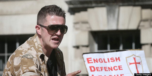 LONDON, ENGLAND - MAY 27: English Defence League (EDL) leader Tommy Robinson speaks to supporters during a rally outside Downing Street on May 27, 2013 in London, England. The EDL are protesting what the group sees as a lack of support and protection given to British troops following the terror attack last week, in which soldier Drummer Lee Rigby was murdered in a knife and machete attack by two Muslim men outside Woolwich Barracks. A counter demonstration is planned by the group Unite Against Facism as tensions run high across certain communities. (Photo by Peter Macdiarmid/Getty Images)