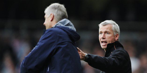 LONDON - NOVEMBER 05: Alan Pardew the West Ham United manager and Arsene Wenger the Arsenal manager exchange words during the Barclays Premiership match between West Ham United and Arsenal at Upton Park on November 5, 2006 in London, England. (Photo by Phil Cole/Getty Images)