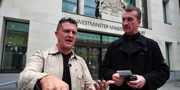 (FILES) In this file picture taken on September 11, 2013 Stephen Yaxley-Lennon (L), also known as Tommy Robinson, the co-founder, spokesman and leader of the English Defence League (EDL) and EDL Deputy Leader Kevin Carroll (R) leave after attending Westminster Magistrates Court in central London. The leader of Britain's far-right, anti-Islamic English Defence League quit on October 8, 2013, saying he felt he could no longer keep 'extremist elements' in the group at bay. In a surprise move, EDL