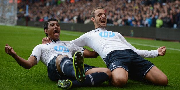 BIRMINGHAM, ENGLAND - SEPTEMBER 24: Jan Vertonghen of Tottenham Hotspur hangs on to the shorts of Nicklas Helenius of Aston Villa during the Capital One Cup third round match between Aston Villa and Tottenham Hotspur at Villa Park on September 24, 2013 in Birmingham, England. (Photo by Laurence Griffiths/Getty Images)