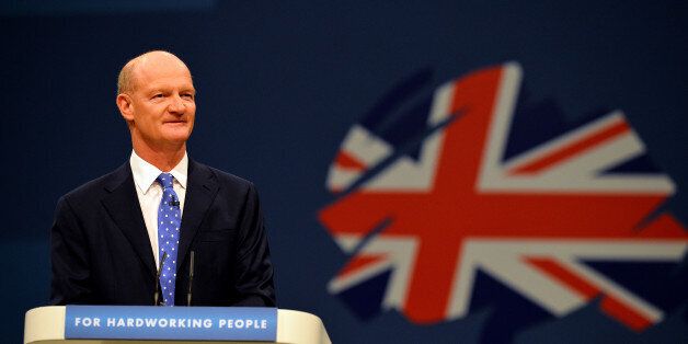 David Willetts, Minister of State for Universities and Science speaks at the Conservative Party Conference in Manchester, north -west England on September 30, 2013. Britons who are out of work for several years will be required to work full-time on community projects to receive state unemployment payments, finance minister George Osborne will announce at the party's annual conference in Manchester, northwest England, in a bid to woo traditional conservative voters ahead of the 2015 general elec