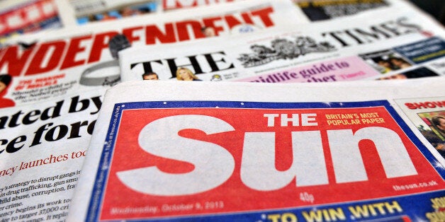 Detailed view of a pile of National newspapers including The Times, The Independent, The Sun and the Daily Mirror