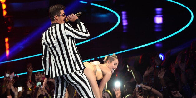 NEW YORK, NY - AUGUST 25: Robin Thicke and Miley Cyrus perform during the 2013 MTV Video Music Awards at the Barclays Center on August 25, 2013 in the Brooklyn borough of New York City. (Photo by Michael Loccisano/FilmMagic)