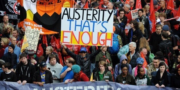 Demonstrators gather in central London on October 20, 2012, as they prepare to march against the government's austerity policies and call for an alternative economic strategy that puts jobs and growth first. Tens of thousands of people marched through London in protest against the British government's austerity measures. Union leaders were set to call for the demonstration to be followed by a general strike against the steep spending cuts introduced by Prime Minister David Cameron's coalition g