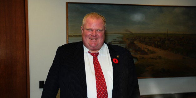 TORONTO, ON - NOVEMBER 8: Toronto Mayor Rob Ford leaves his office for the day with his new driver, saying he has personal issues to deal with. November 8, 2013. (Colin McConnell/Toronto Star via Getty Images)