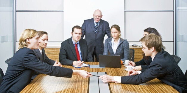 seven people in a cubicle ...