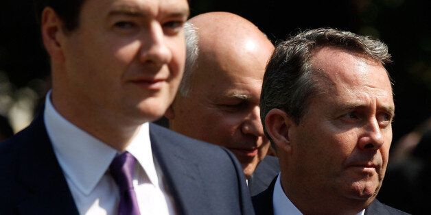 LONDON, ENGLAND - JULY 04: Chancellor George Osborne, Work and Pensions Secretary Iain Duncan Smith and Defence Secretary Liam Fox look towards the media after a statue of former U.S. President Ronald Reagan was unveiled in the grounds of the American Embassy on July 4, 2011 in London, England. Today would have been Reagan's 100th Birthday. The 40th President of the United States of America enjoyed close ties with the British Prime Minister Margaret Thatcher. (Photo by Matthew Lloyd/Getty Imag