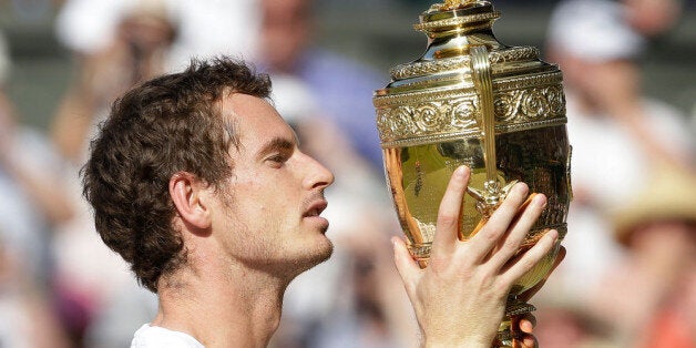 LONDON, ENGLAND - JULY 07: Andy Murray of Great Britain poses with the Gentlemen's Singles Trophy following his victory in the Gentlemen's Singles Final match against Novak Djokovic of Serbia on day thirteen of the Wimbledon Lawn Tennis Championships at the All England Lawn Tennis and Croquet Club on July 7, 2013 in London, England. (Photo by Pool/Getty Images)