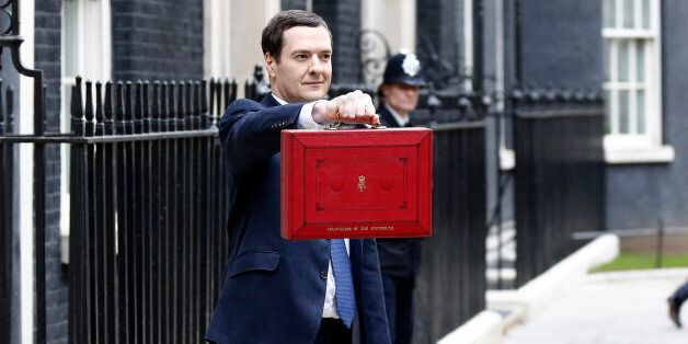 George Osborne, U.K. chancellor of the exchequer, holds the dispatch box containing the 2014 budget as members of the H.M. Treasury leave 11 Downing Street in London, U.K., on Wednesday, March 19, 2014. Osborne will lay out a budget today focused on securing Britain's economic recovery and rebutting opposition Labour Party claims that he's ignoring the rising cost of living. Photographer: Simon Dawson/Bloomberg via Getty Images