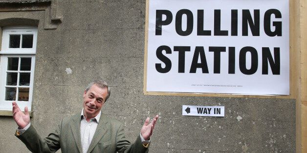 BIGGIN HILL, UNITED KINGDOM - MAY 22: United Kingdom Independence Party (UKIP) leader Nigel Farage gestures as he arrives at a polling station on May 22, 2014 near Biggin Hill, England. Millions of voters are going to the polls today in local and European elections. (Photo by Peter Macdiarmid/Getty Images)