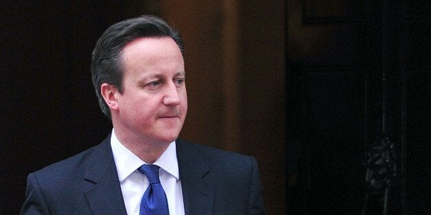 British Prime Minister David Cameron (L) prepares to welcome Irish President Michael Higgins at Downing Street in central London on April 9, 2014. Higgins arrived in London on April 8 in the first state visit by a president of the republic since it gained independence from neighbouring Britain. AFP PHOTO / CARL COURT (Photo credit should read CARL COURT/AFP/Getty Images)