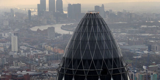 Embargoed to 0001 Thursday June 12 File photo dated 25/02/10 of a view of the Gherkin and Canary Wharf at sunrise from the City of London as tourists are forced to splash the cash more in London than in any other major world city, according to a survey.