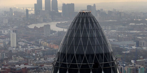 Embargoed to 0001 Thursday June 12 File photo dated 25/02/10 of a view of the Gherkin and Canary Wharf at sunrise from the City of London as tourists are forced to splash the cash more in London than in any other major world city, according to a survey.