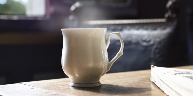 cup of tea on table with steam