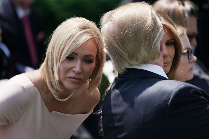 President Donald Trump speaks to Paula White, his spiritual adviser, during a National Day of Prayer service in the Rose Garden at the White House on May 2, 2019.
