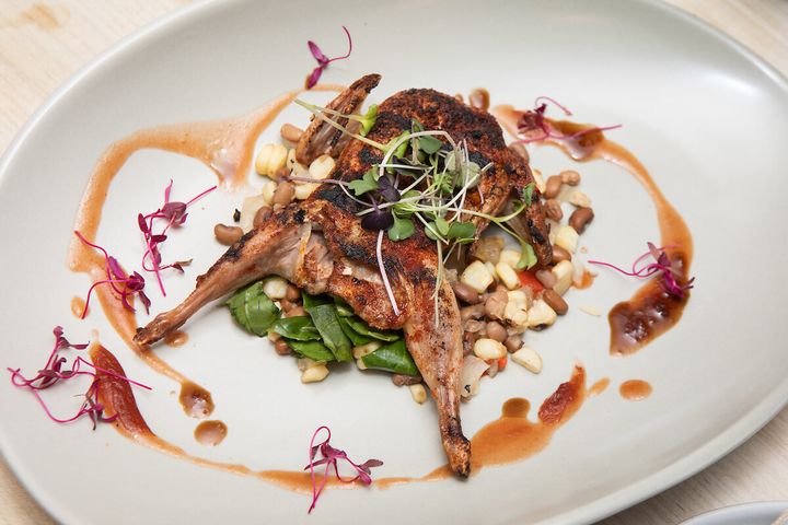 Barbecued quail with smoked watermelon-tomato purée, roasted corn, Sea Island pea succotash and pickled collard greens.