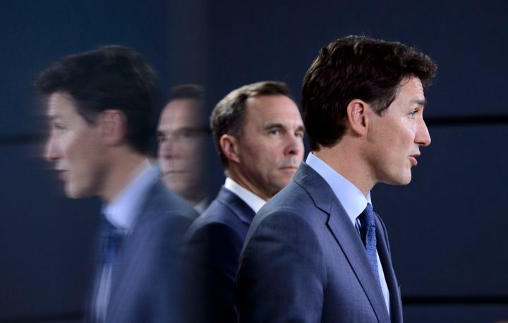 Prime Minister Justin Trudeau, right, makes an announcement regarding the government's decision on the Trans Mountain Expansion Project on Tuesday, June 18, 2019.
