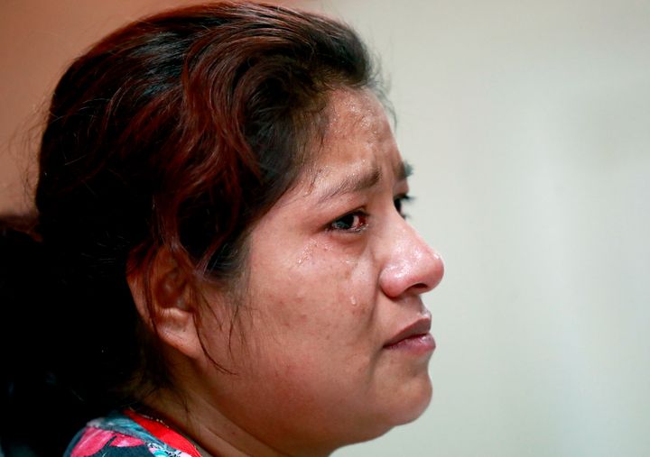Miriam, from Guatemala, recounts her separation from her child at the border during a news conference at the Annunciation House, Monday, June 25, 2018, in El Paso, Texas. The Trump administration's family separation policy was made possibly by a nearly century-old law criminalizing unauthorized border crossings.