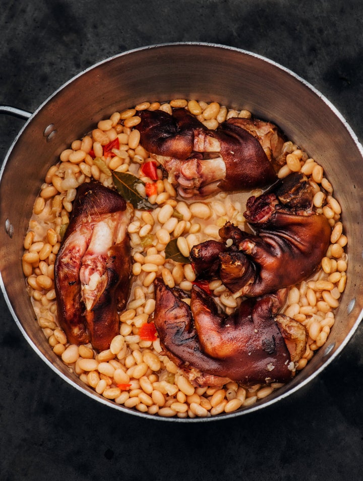 Isaac Toups suggests cooking trotters in beans, which soak up their rich flavor.