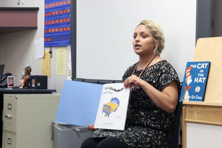 Ashley Navarette reads a book to her morning preschool class. 