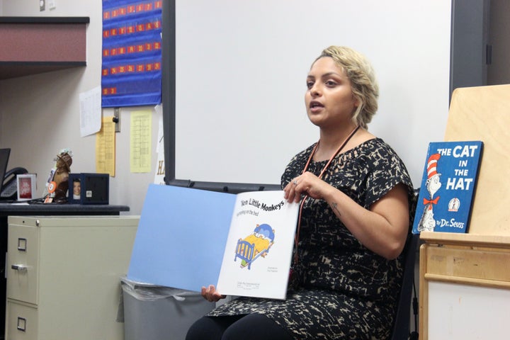 Ashley Navarette reads a book to her morning preschool class.