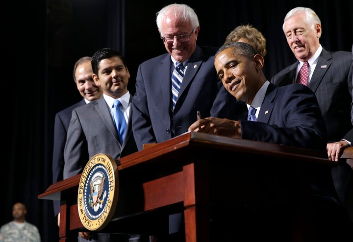 Former President Barack Obama in 2014 signing into law the "VA Choice" bill that President Donald Trump falsely claims he bro