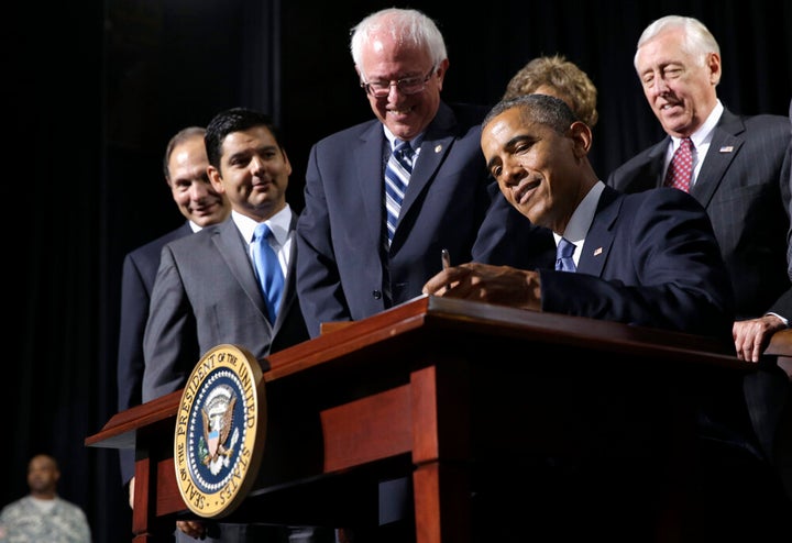 Former President Barack Obama in 2014 signing into law the "VA Choice" bill that President Donald Trump falsely claims he brought into being.