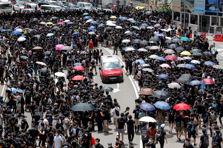 The protesters gathered outside Hong Kong government offices on Friday morning after a deadline passed for meeting their demands related to a controversial extradition bill that many see as eroding the territory's judicial independence.