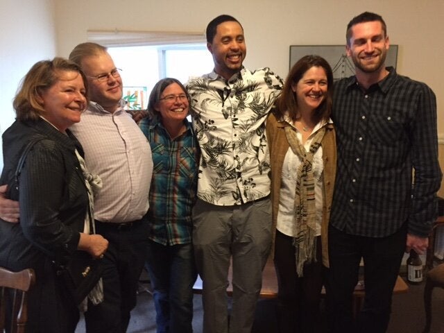 Jamal (center) with several of the jurors who acquitted him at a party following his acquittal in 2015. 