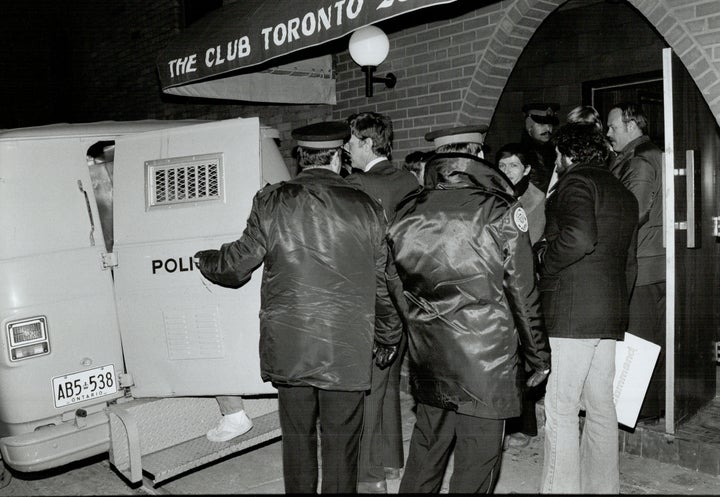 Police arrest patrons at a Toronto bathhouse as part of citywide raids Feb. 5, 1981. 