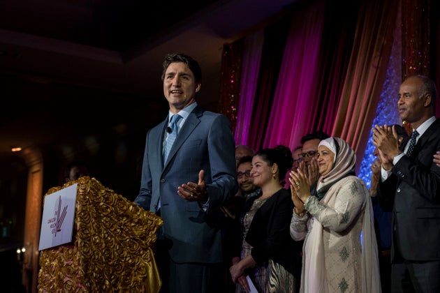 Trudeau is joined by members of the Liberal caucus while speaking at the Canadian Muslim Vote's Eid Dinner,...