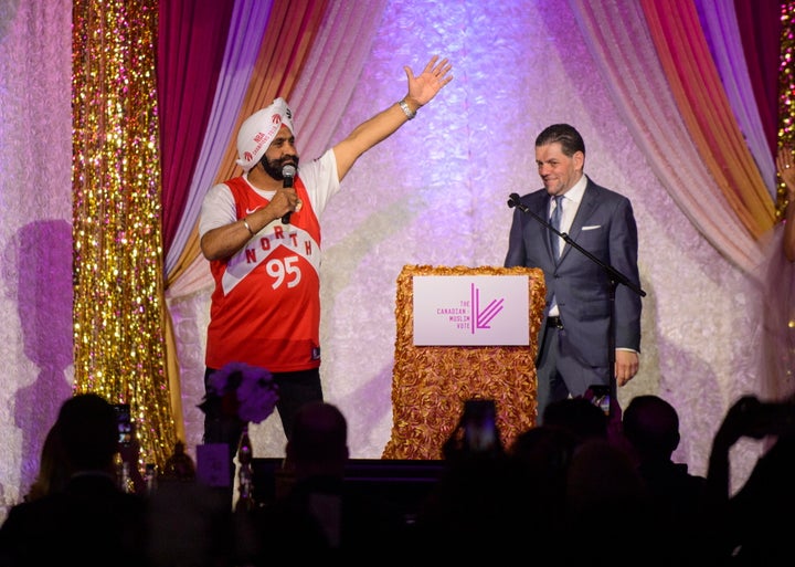 Toronto Raptors superfan Nav Bhatia speaks to a crowd at the Eid Dinner with Paramount Fine Foods owner Mohamad Fakih in Toronto, on June 21, 2019. 