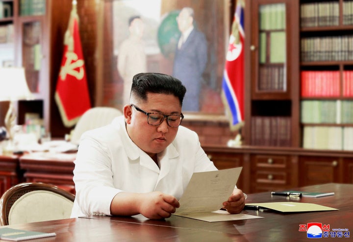 The state-run Korean Central News Agency included a photo of Kim Jong Un apparently reading a letter from Trump in its report on Sunday.