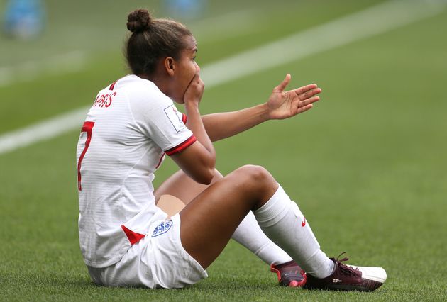 England's Nikita Parris is fouled by Cameroon's Yvonne Leuko