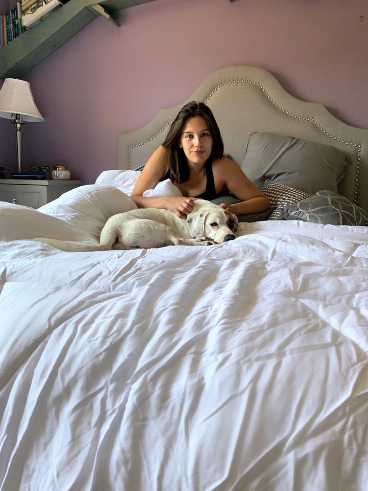 Writer Danielle Gonzalez and her pup, April, enjoying the Buffy Cloud Comforter.
