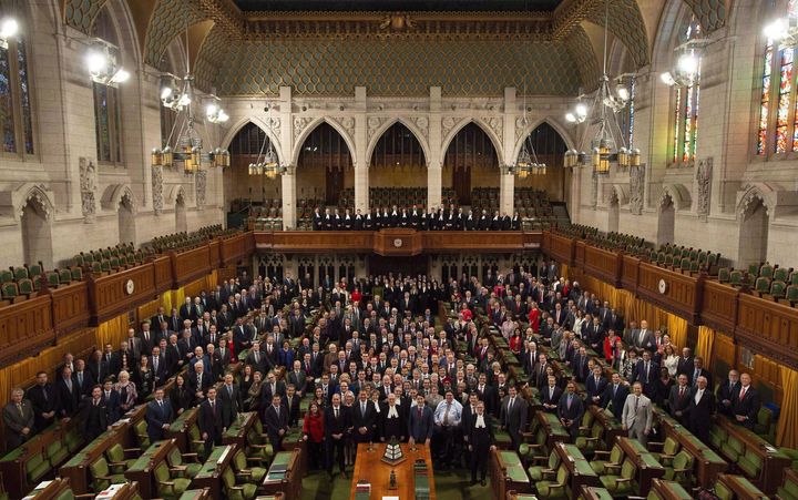 Members of the House of Commons pose for a photo in the chamber before question period in the House of Commons on Dec. 12, 2018.