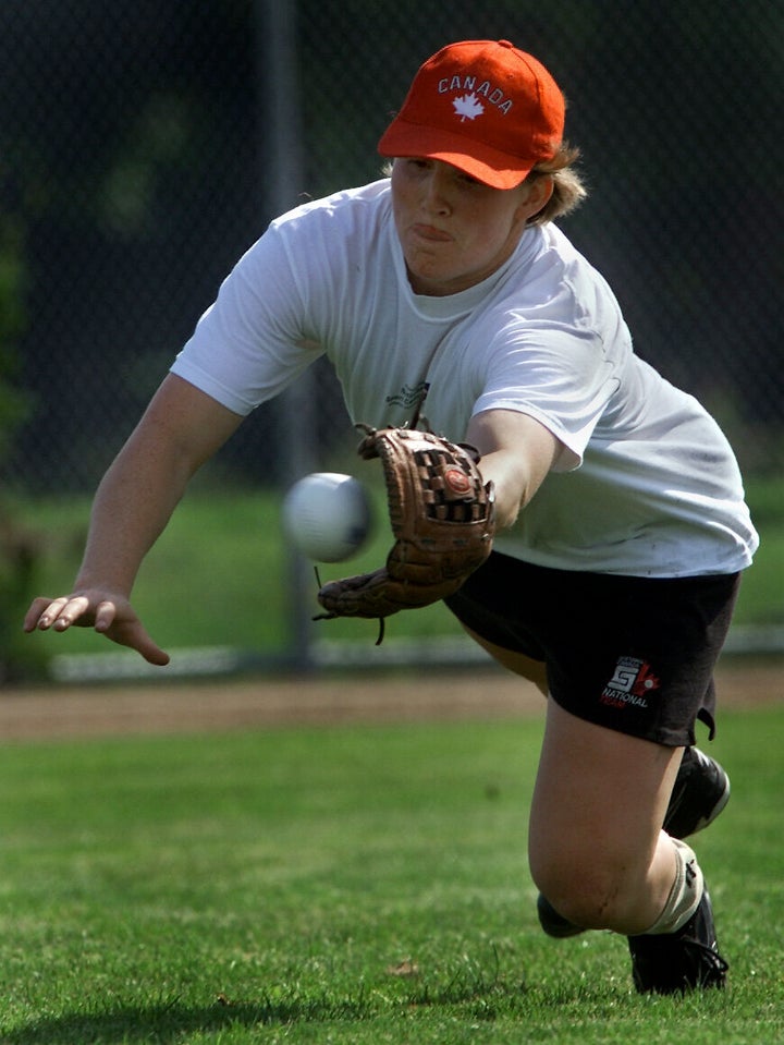 A young Hayley Wickenheiser fields a ball for Team Canada in 2000. 